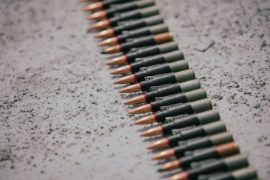 Close up shot of a machine gun belt loaded with cartridges.