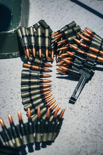 Close up shot of a machine gun belt loaded with cartridges.