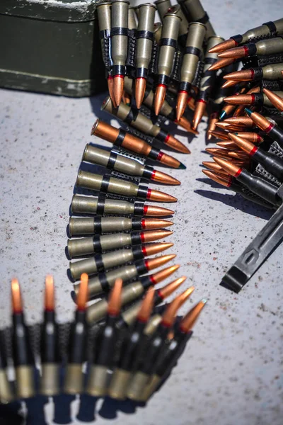 Close up shot of a machine gun belt loaded with cartridges.