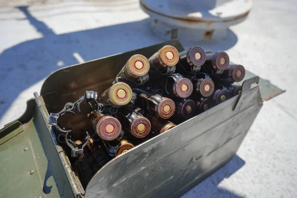 Close up shot of a machine gun belt loaded with cartridges.
