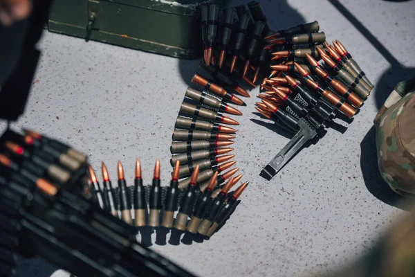 Close up shot of a machine gun belt loaded with cartridges.