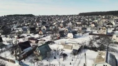 cottage village in winter. 4k drone footage