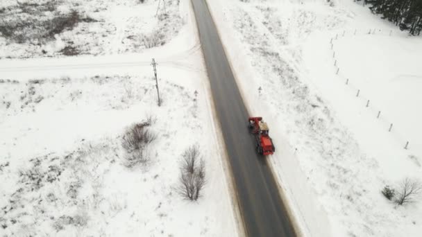 Road construction equipment clears roads after a snowfall — Stock Video