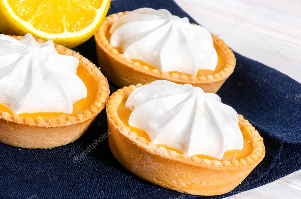 Cheesecake lemon tart cake or pie, with fresh lemon and mint. White background, lifestyle healthy sweet food