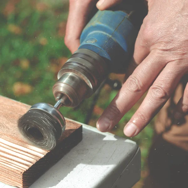 Wire brush for wood working. Tool for treatment wood. Drill with a wire brush