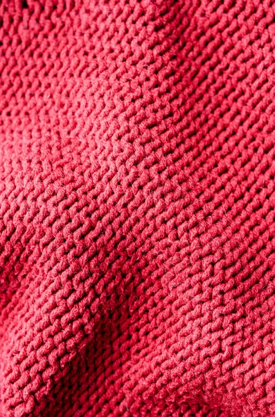 A cozy wool background. Colored cozy woolen background. Coarse wool knit