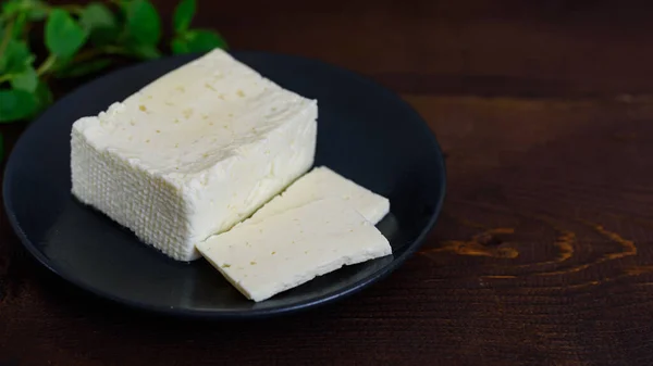 Large Piece Feta Cheese Dark Wooden Table Selective Focus — Stock Photo, Image