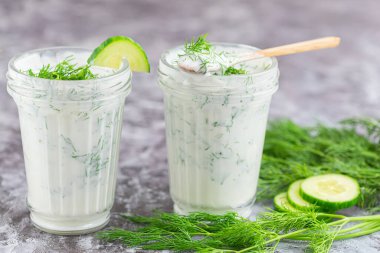 Smoothies from kefir, dill and cucumbers. Close up.