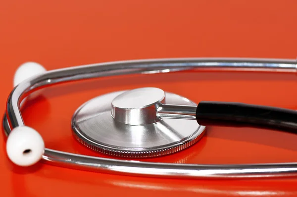 Stethoscope on red — Stock Photo, Image