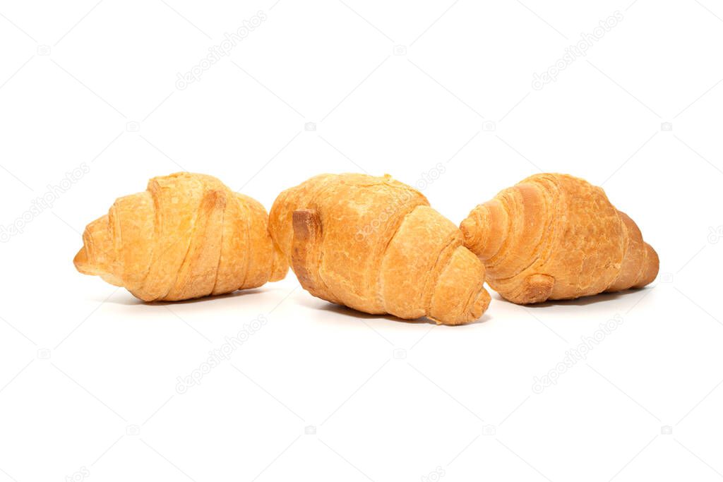 Three mini croissants in a row, real photos. White background. Traditional french pastry. Close up, copy space.