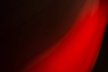 Siyah arkaplanda soyut kırmızı ışık. Arkaplan.