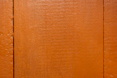 Kırmızımsı kahverengi boyayla boyanmış tahta tahtalar. Arkaplan