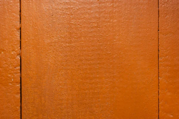 Wooden boards painted in reddish-brown paint. Backdrop