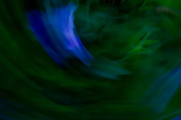Abstraction background from green and blue colors, refraction and folding. Backdrop