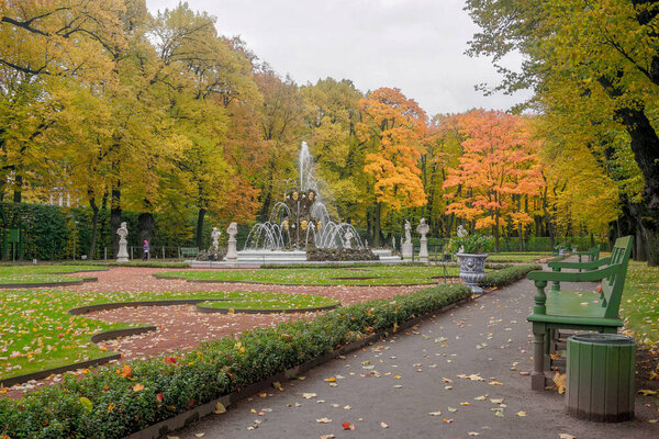 Beautiful autumn summer garden with fountains in St. Petersburg in Russia.