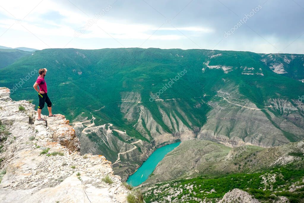 Traveler on a rock near the Sulak canyon in Dagestan