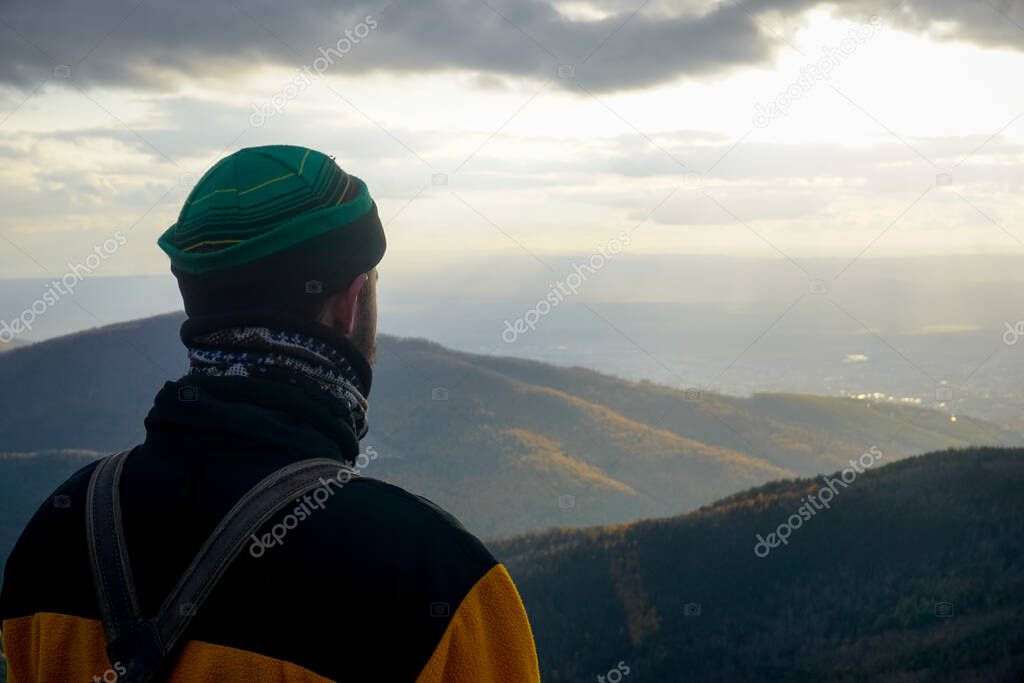 Traveler on top of a Chekhov peak at sunset. Sakhalin island