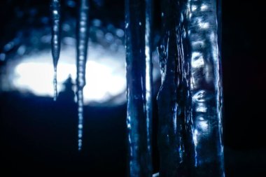 Icicles in an ice cave in Kamchatka peninsula in winter clipart