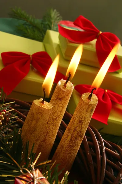 Christmas candle and gifts — Stock Photo, Image