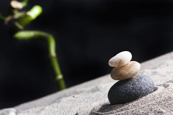 Three stones in the sand bamboo — Stock Photo, Image
