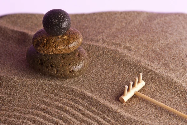 Three stones in the sand — Stock Photo, Image