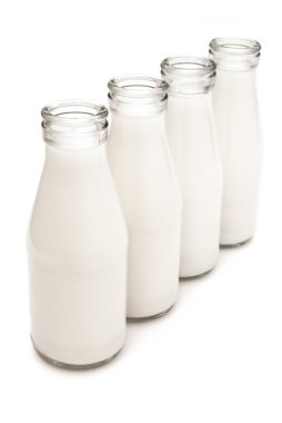 4 milk bottles with clipping path clipart