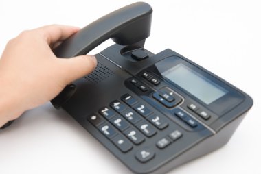 adam bir telefon ahizesi kaldırma
