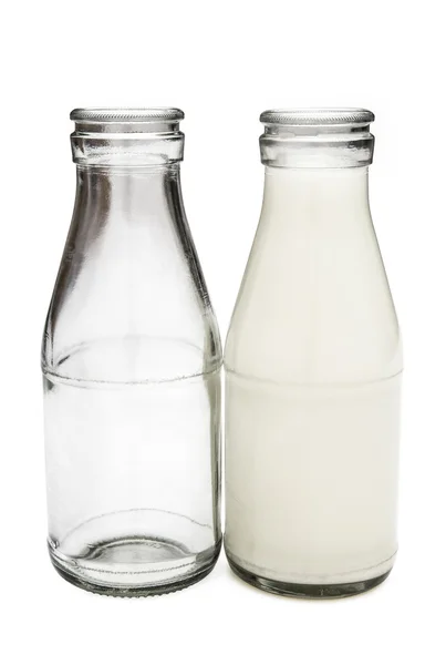 Full and empty milk bottles with clipping path — Stock Photo, Image