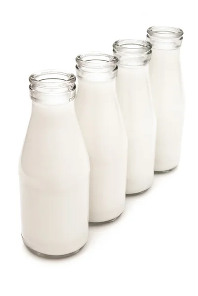 4 milk bottles with clipping path — Stock Photo, Image