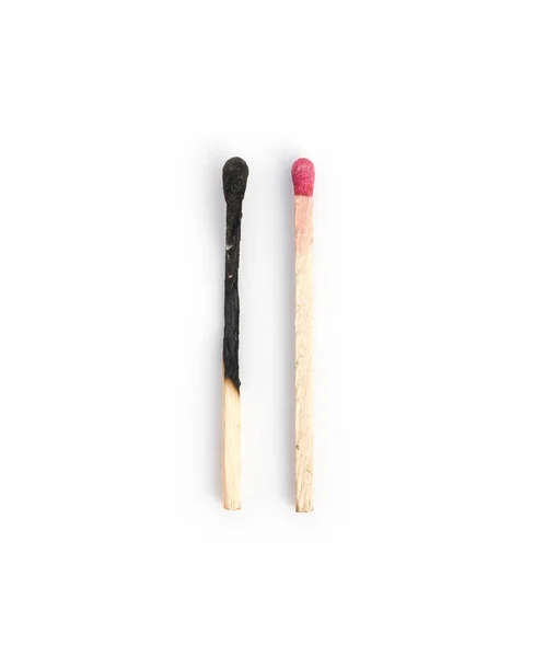 Burnt and new red matches vertical composition — Stock Photo, Image