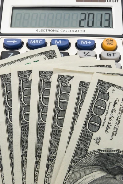 Us paper currency and calculator shows 2013 — Stock Photo, Image