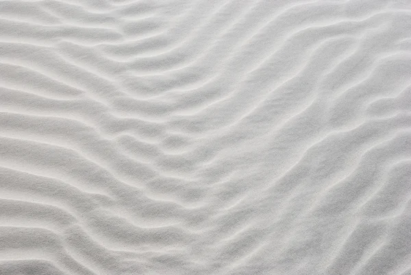 Beżowym tle piasek — Zdjęcie stockowe