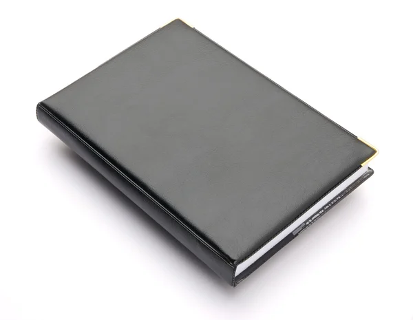 Caderno de capa preta sobre branco — Fotografia de Stock