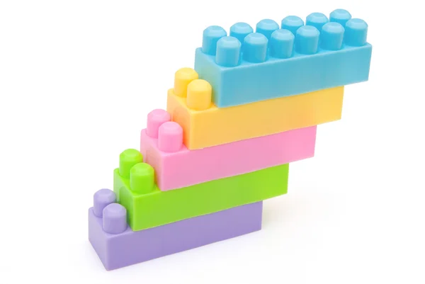 Different color toy bricks stack together — Stock Photo, Image