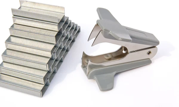 Stacked staples and staple remover — Stock Photo, Image