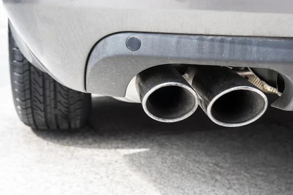 Exhaust pipe of a silver car — Stock Photo, Image