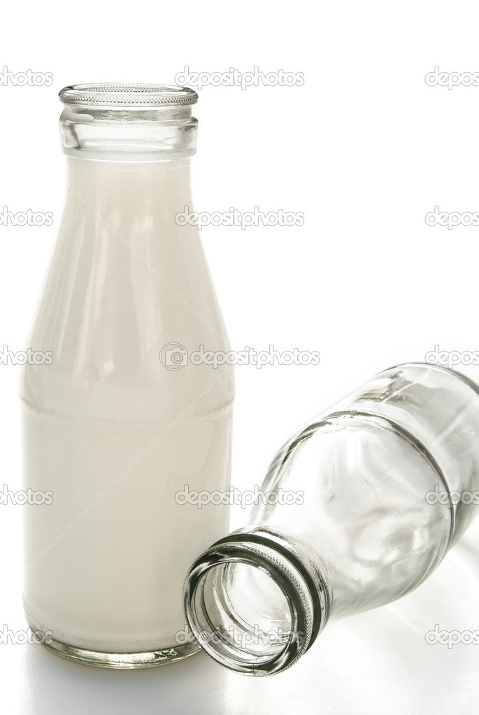 Full and empty milk bottles with clipping path