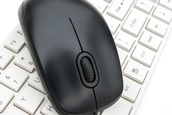 Black mouse and white keyboard — Stock Photo, Image