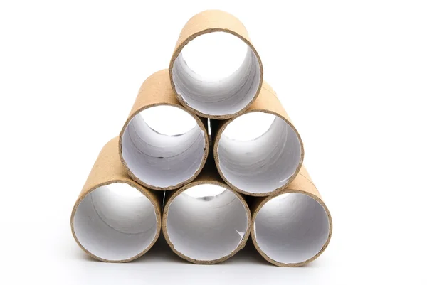 Empty toilet rolls stack up on white — Stock Photo, Image