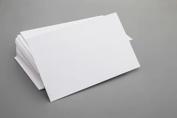 Blank business cards stack up on grey background — Stock Photo, Image