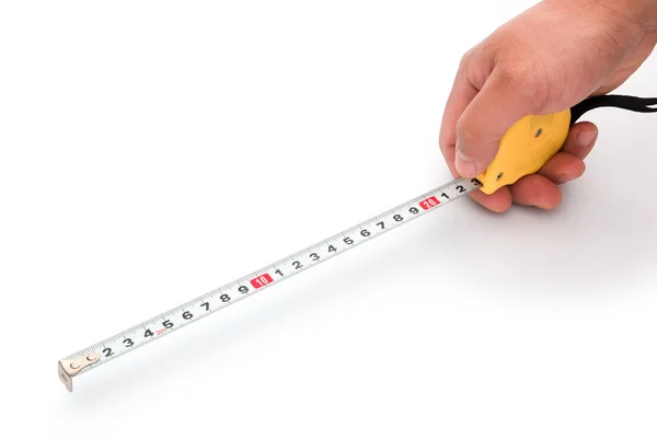 Hand holding a tape measure with clipping path — Stock Photo, Image