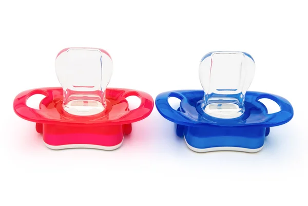 Red and blue pacifiers isolated on white with clipping path — Stock Photo, Image