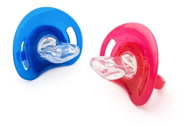 Red and blue pacifiers isolated on white with clipping path — Stock Photo, Image