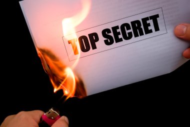 Burning a top secret paper document clipart