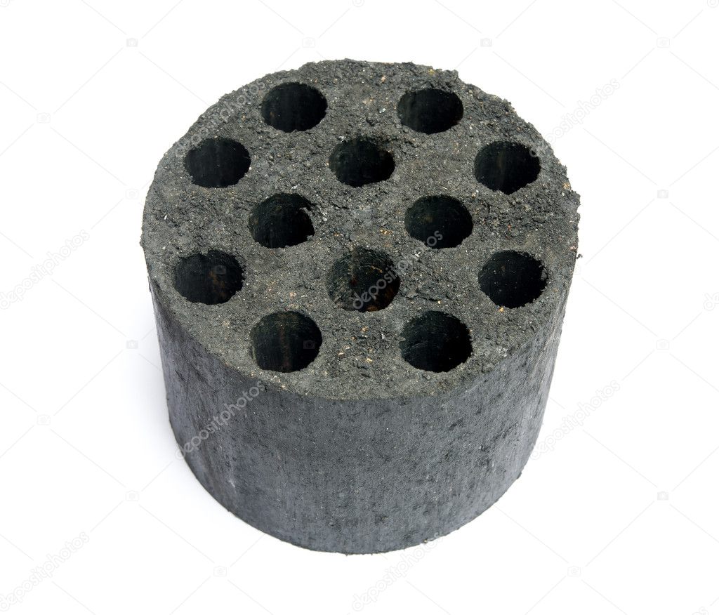 New coal briquette on a white background