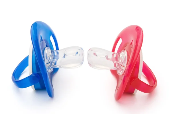 Red and blue pacifiers isolated on white with clipping path — Stock Photo, Image
