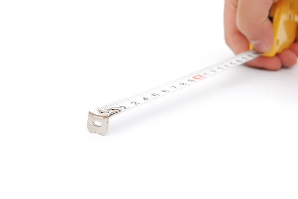 Hand holding a tape measure on white — Stock Photo, Image