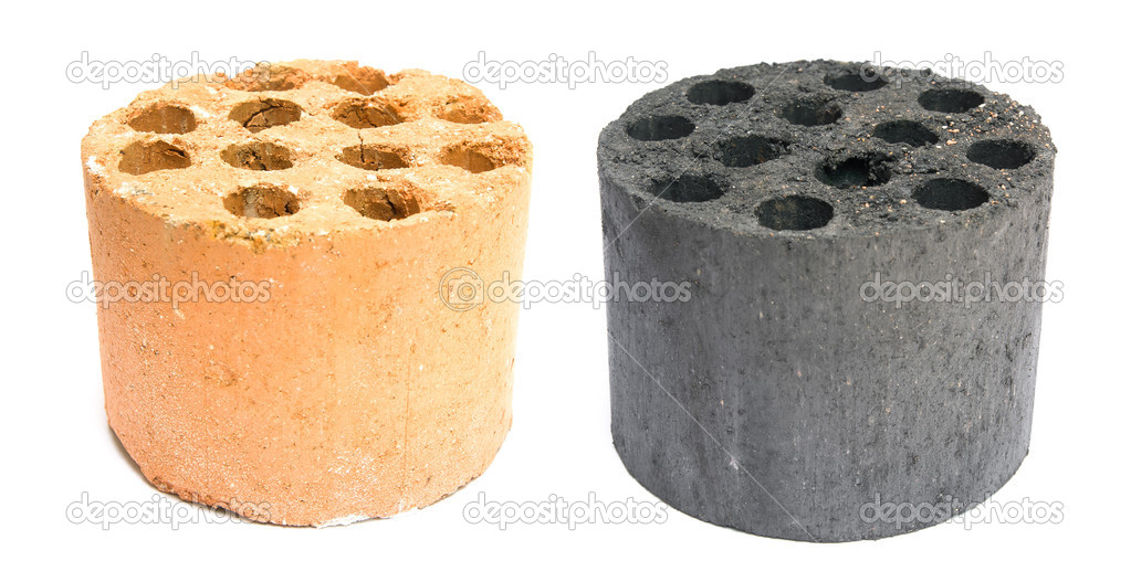 Used and new coal briquette on a white background