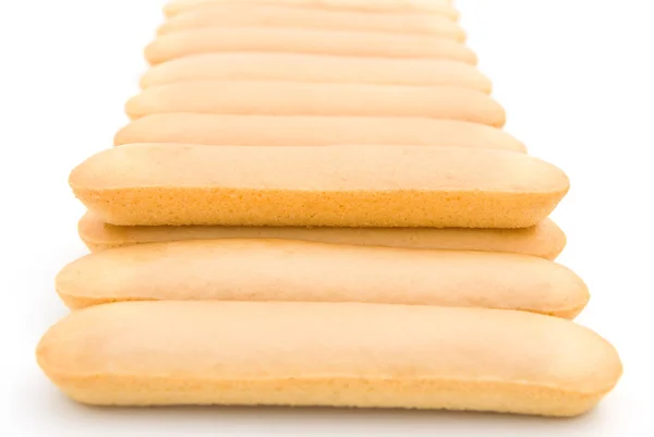 Biscuit sticks line up on white — Stock Photo, Image