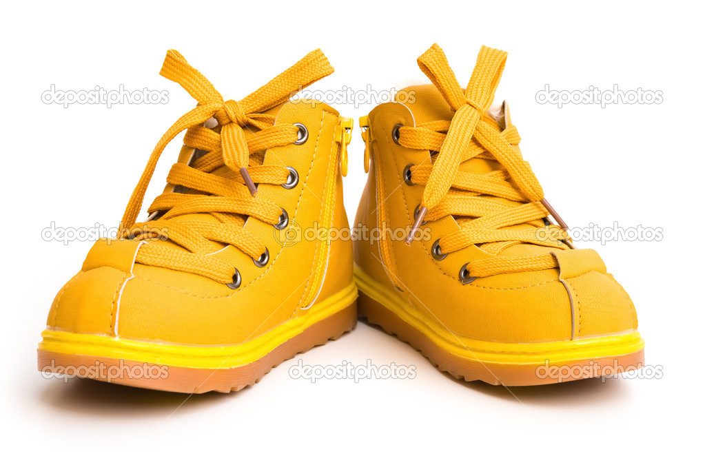 Pair of orang shoes for kid on white background